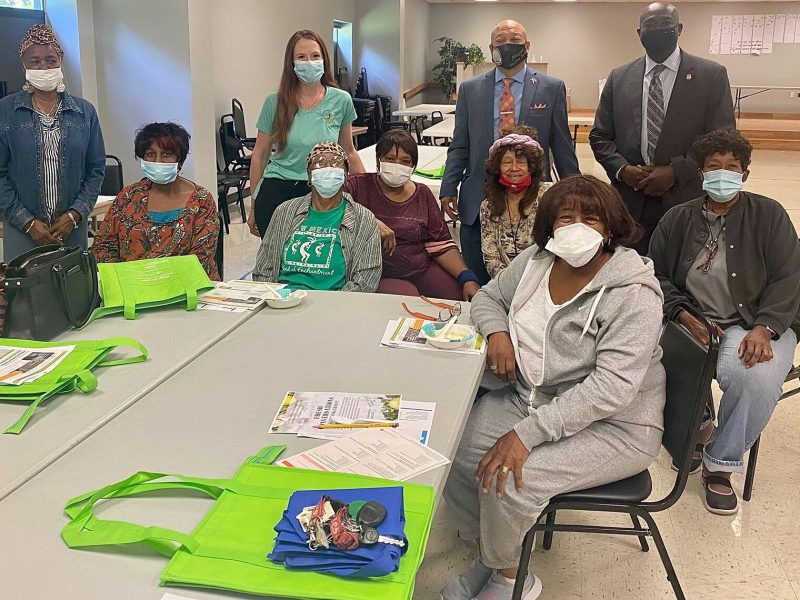 Flint Mayor Sheldon Neeley (in red tie) joins SNAP-Ed Nutrition Educator Amanda Mattila and residents during a Fresh Conversations session at Hasselbring Senior Center in Flint.