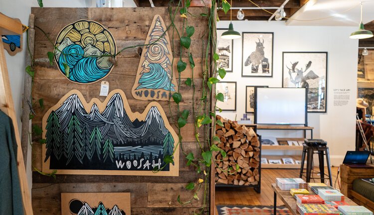 Outdoor-inspired art inside Woosah Outfitters. 