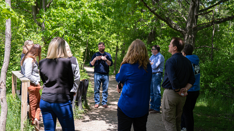 Dennis Pilaske of Chippewa Nature Center talking with the ORAC group about education efforts.