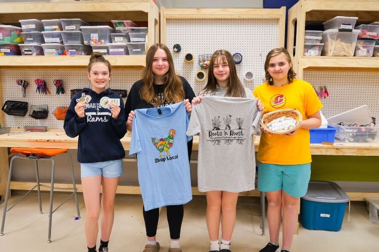 Students in Renaissance’s Maker Space where they hand-print their merchandise. Pictured left to right: Brooklyn Wilson, Zoe Pastotnik, Anara Tollenaera, and Zoey Kregel.