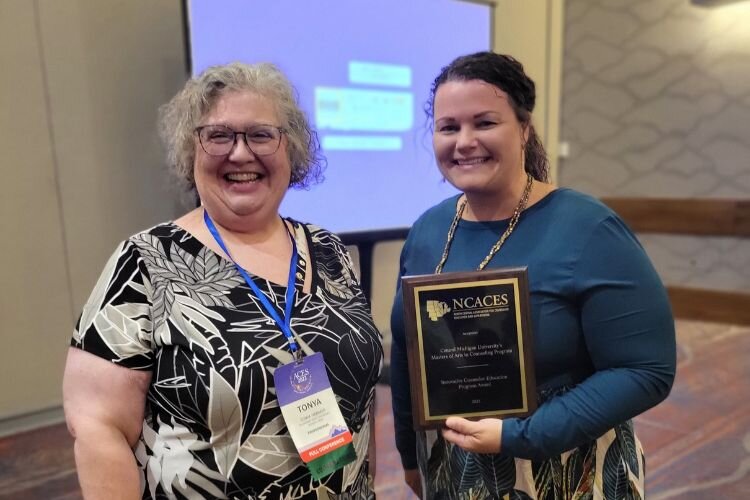 Allison Arnekrans (pictured right), poses in Denver, CO as the CMU counseling program received national recognition as recipients of the NCACES Innovative Counselor Education Program Award.