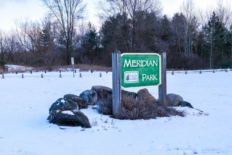 Meridian Parks’s serene trails with river views allow for winter hiking and snowshoeing in Mt. Pleasant.