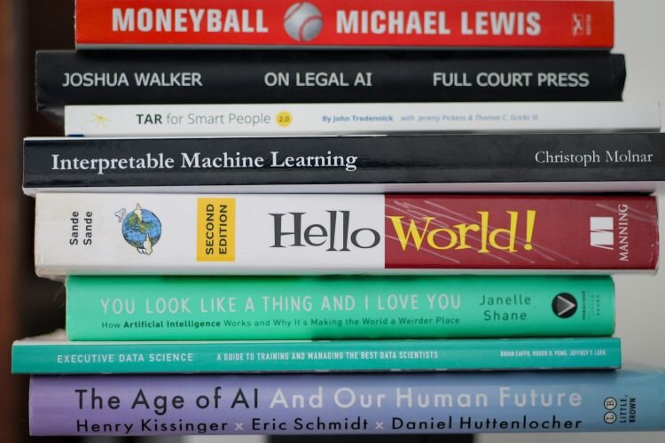 AI books line Jenson’s Two Rivers office.