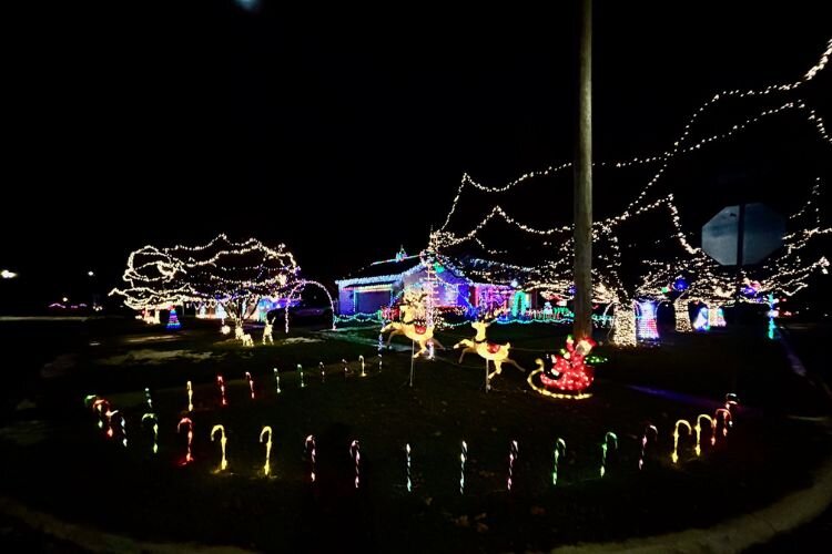 At 1054 E. Maple Street, the Gurski family decorates their home near McLaren Central Michigan Hospital.