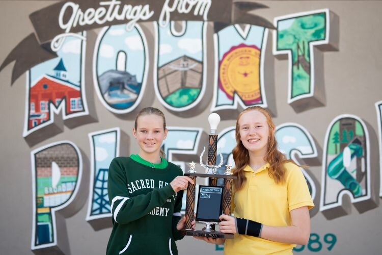 Olivia Harding (left) and Claire Campbell (right) with the PITCHER-THIS competition’s traveling trophy.