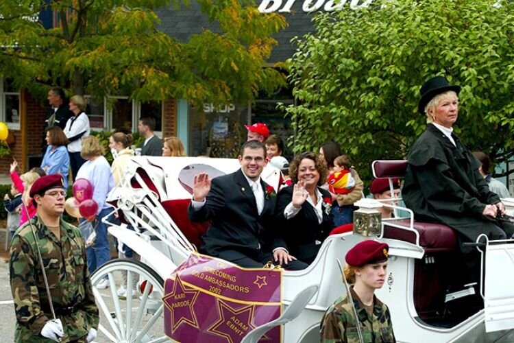 2002’s CMU Homecoming Gold Ambassadors participating in the parade through campus and downtown Mt. Pleasant.