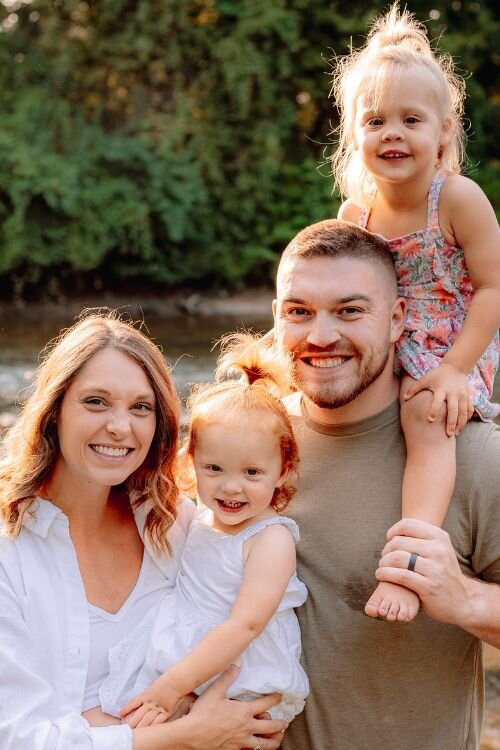 Dylan poses with his wife, Kara, and children Hadley and Collins.