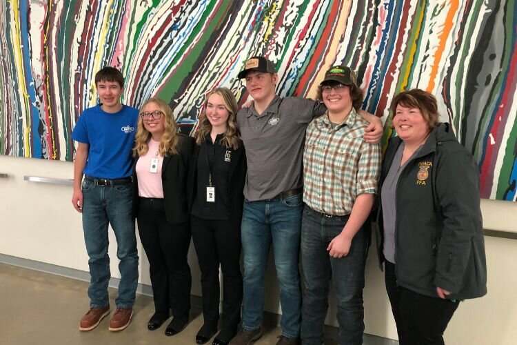 Kenny Daniels with members of Ithaca High School’s FFA team. 