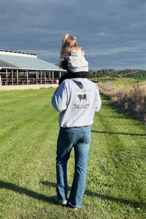 Tyrel Hoover at LRW Farms with his daughter.