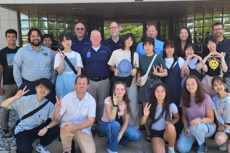 Students in front of Mitsuba after a tour of the plant.