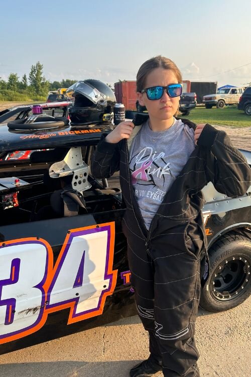 Maggie Dickman with her car at the Mt. Pleasant Speedway.