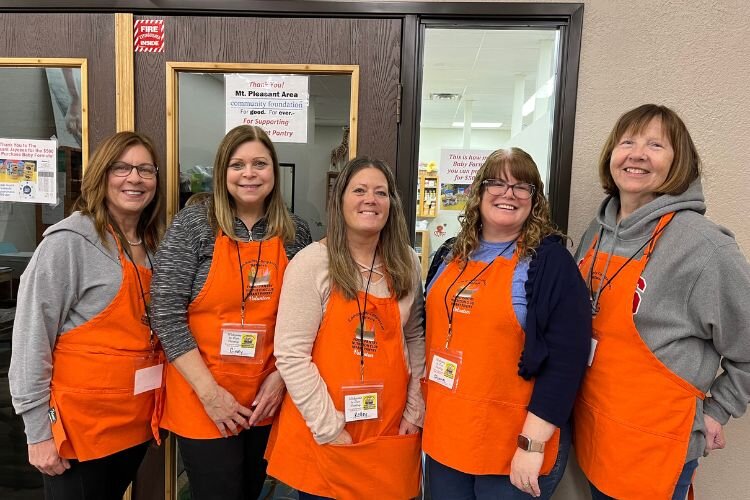 Rotarians volunteering at the Community Compassion Network.