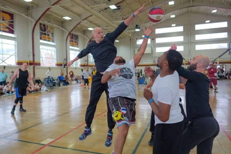 Chris Kaman blocks a shot in the Top Men’s division of the Gus Macker 3-on-3 basketball tournament in Mt. Pleasant, MI on Saturday, April 27, 2024. Kaman is a former CMU standout who played 13 seasons in the NBA. Kaman was an NBA All-Star.