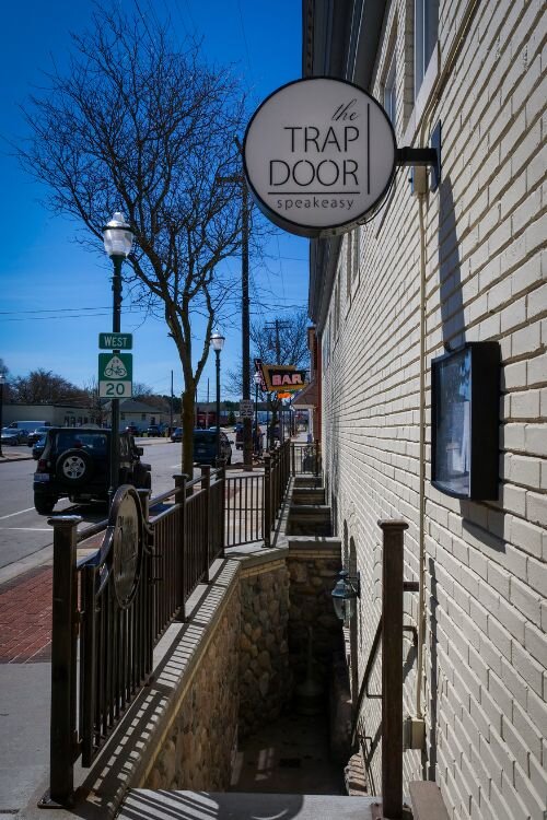 The Trap Door within the “500 District” provides a selection of hand-crafted cocktails, rare whiskeys, craft beer, and elegant wines in their underground establishment which imitates bars from the Prohibition era. Photo Credit: Courtney Jerome / Epicenter Mt. Pleasant