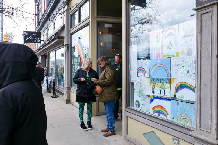 Students’ artwork lines windows in participation of the window decorating contest for the Clare Irish Festival. Photo Credit: Courtney Jerome / Epicenter Mt. Pleasant