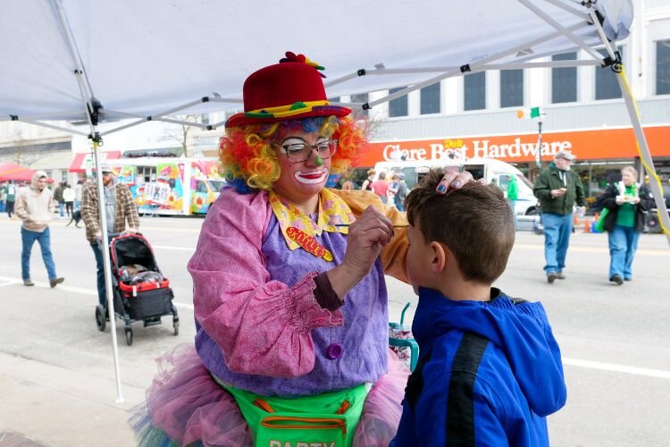"Skittles” offered childrens’ face painting in downtown Clare outside of 505 Cafe on March 16, 2024 during the 49th Annual Clare Irish Festival. Photo Credit: Courtney Jerome / Epicenter Mt. Pleasant