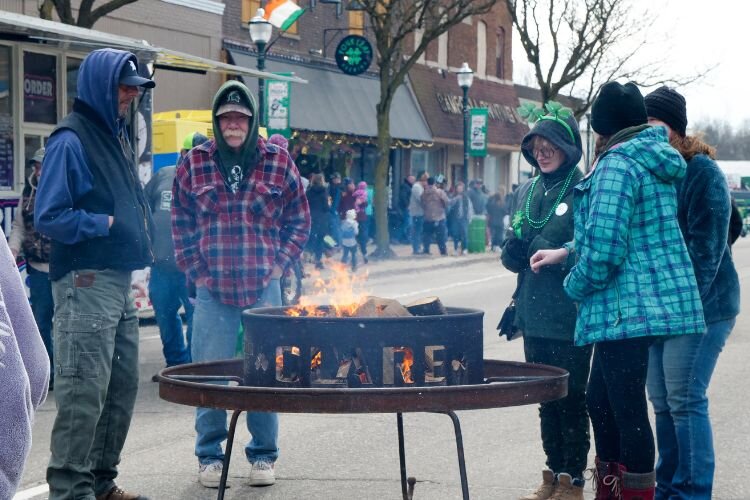 Firepits fueled heat to festival attendees during the brisk spring weather of the Clare Irish Festival. Photo Credit: Courtney Jerome / Epicenter Mt. Pleasant