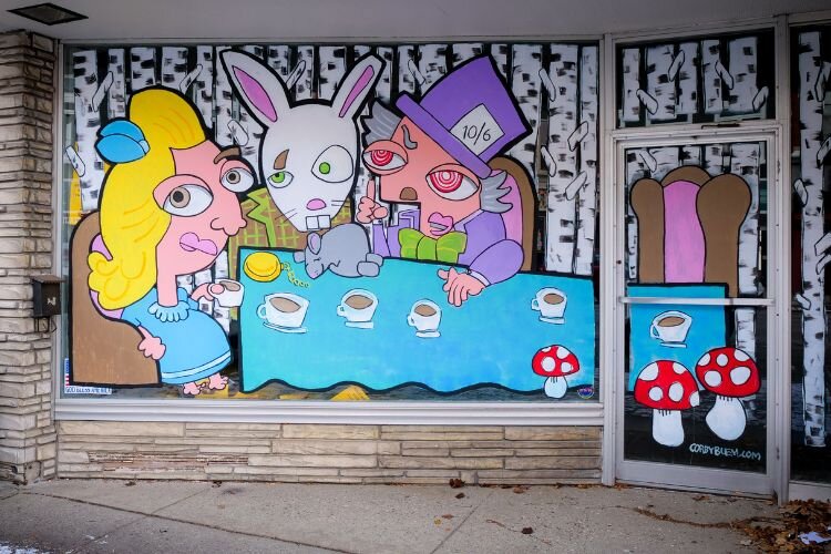 Artist Corby Blem’s painting of the “Mad Hatter’s Tea Party” at 818 Broadway in downtown Mt. Pleasant. Photo Credit: Courtney Jerome / Epicenter Mt. Pleasant