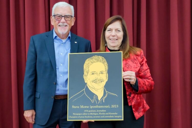 Steve Morse was inducted posthumously, his wife, Jennifer Rich, accepted the award on behalf of the Morse family. She is pictured with Rick Fitzgerald, associate vice president for public affairs for the University of Michigan Ann Arbor. Fitzgerald was a fraternity brother of Morse at CMU; he nominated Morse for the honor and introduced him at the event.