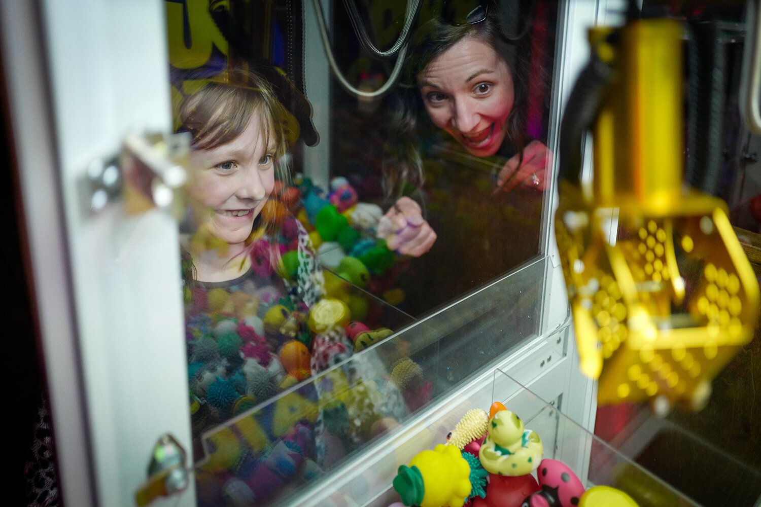Amelia (age 7) of Mt. Pleasant, MI joyfully reacts to winning a prize in the “Duck Catcher” arcade game at The Bird Bar and Grill in Mt. Pleasant, MI. (Photo: Dan Gaken/Epicenter)