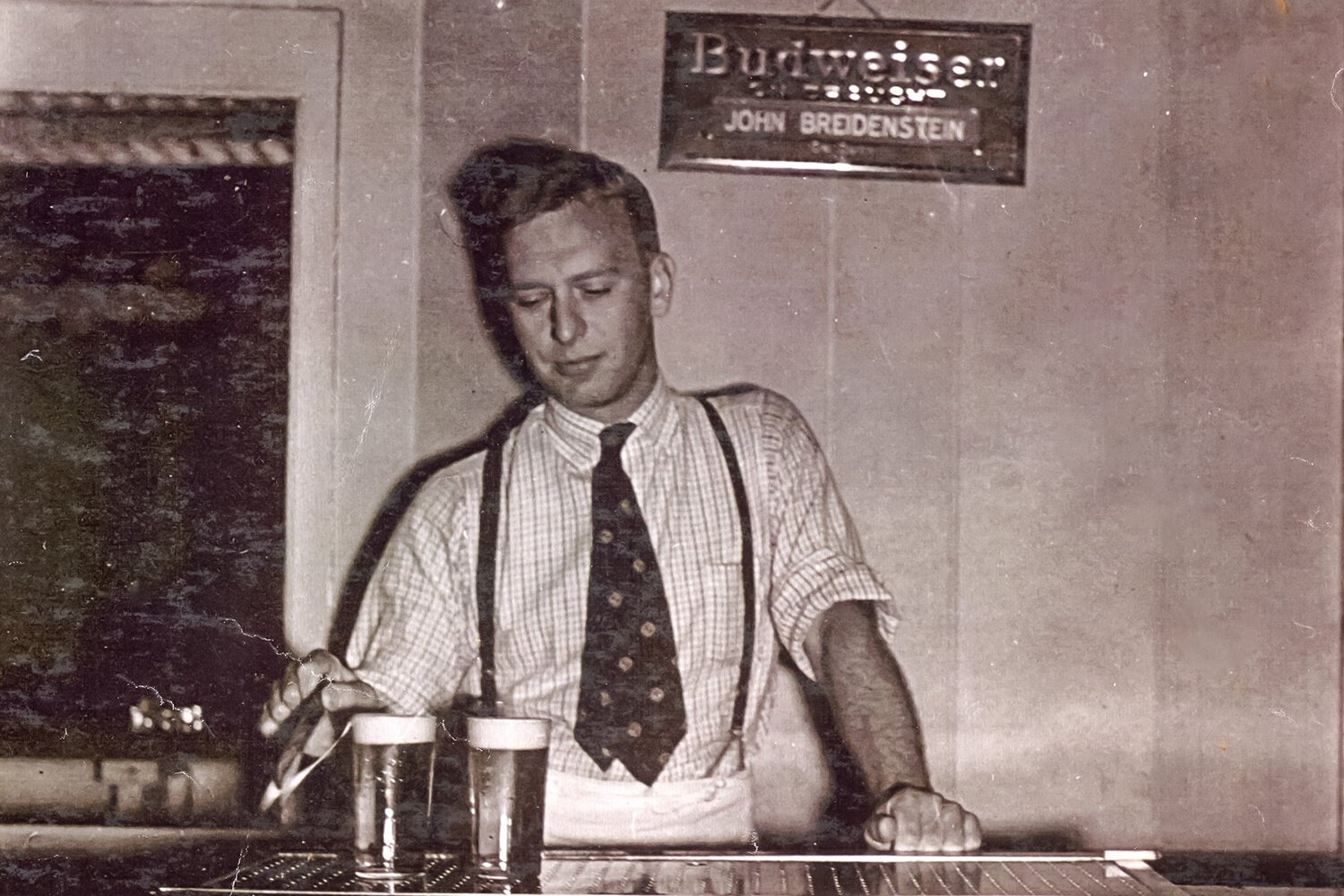 John Breidenstein, the original proprietor of The Bird, tends bar at the establishment’s original location in Mt. Pleasant’s Bennett Hotel. (Undated photo courtesy of the Breidenstein Family)