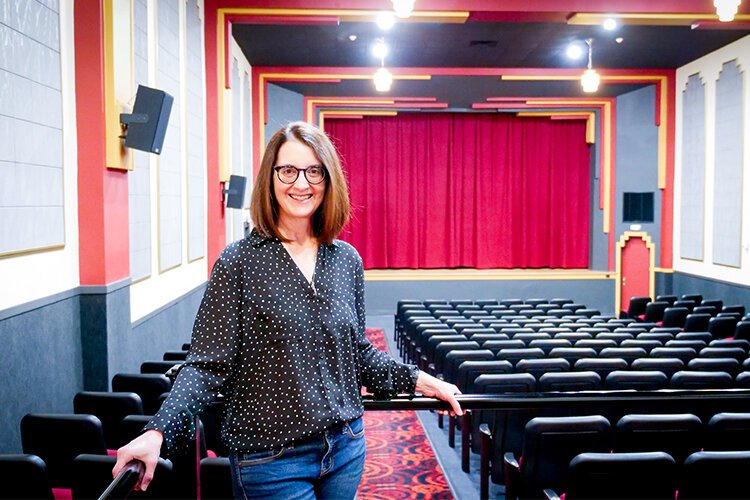 Lisa Benic chats with Epicenter inside the newly renovated Ideal Theater at 609 N McEwan St in Clare, Michigan. (Photo: Courtney Jerome/Epicenter)