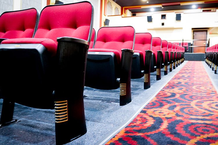 Lisa Benic and her sisters restored the Ideal Theater’s original cast iron seat standards. (Photo: Courtney Jerome/Epicenter)