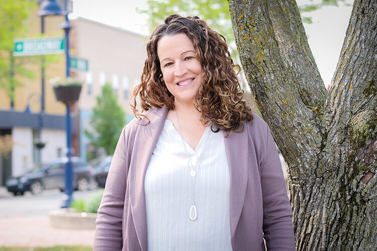 Angie Evans poses for a photograph in Downtown Mt. Pleasant after recently being awarded 2023’s The Good Prize from United Way of Gratiot and Isabella Counties. (Photo: Courtney Jerome/Epicenter)