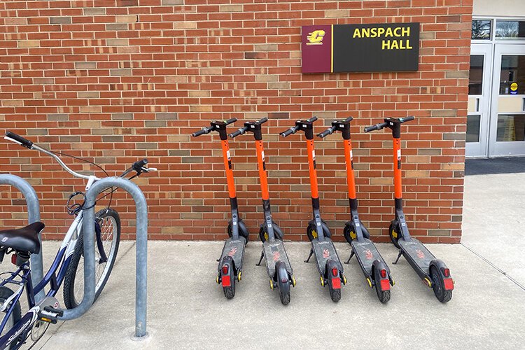 SPIN e-scooters outside of Anspach Hall on Central Michigan University's campus in Mt. Pleasant, Michigan. (Photo: Adison Reder/Epicenter)