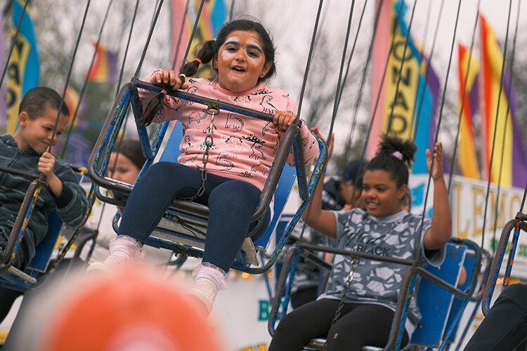 Festival goers partake in the Midway Carnival at the 2023 Maple Syrup Festival in Shepherd, MI on Saturday, April 29, 2023. (Photo: Dan Gaken/Epicenter)