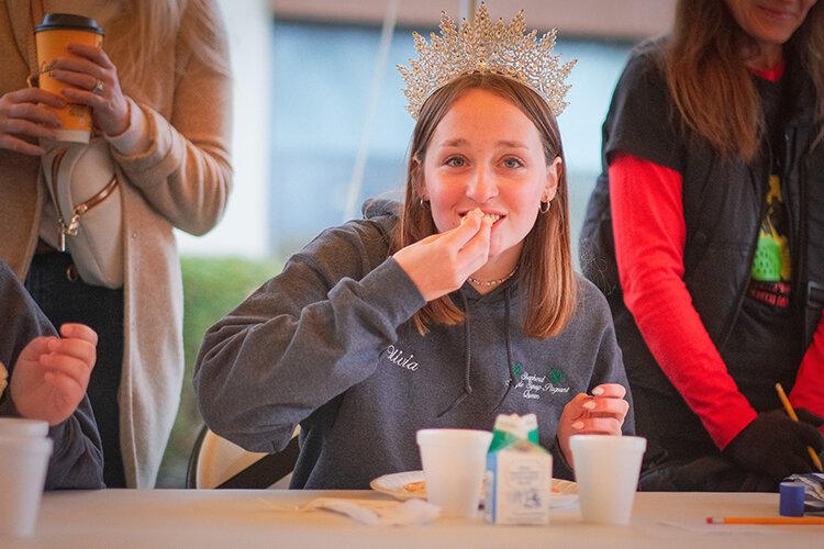Olivia Hipkins, the 2023 Maple Syrup Queen, competes in the pancake eating contest at the Maple Syrup Festival in Shepherd, MI on Sunday, April 30, 2023. (Photo: Dan Gaken/Epicenter)