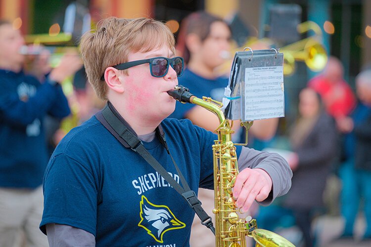 The Shepherd High School Marching Band members participate in the Maple Syrup Festival Parade in Shepherd, MI on Sunday, April 30, 2023. (Photo: Dan Gaken/Epicenter)