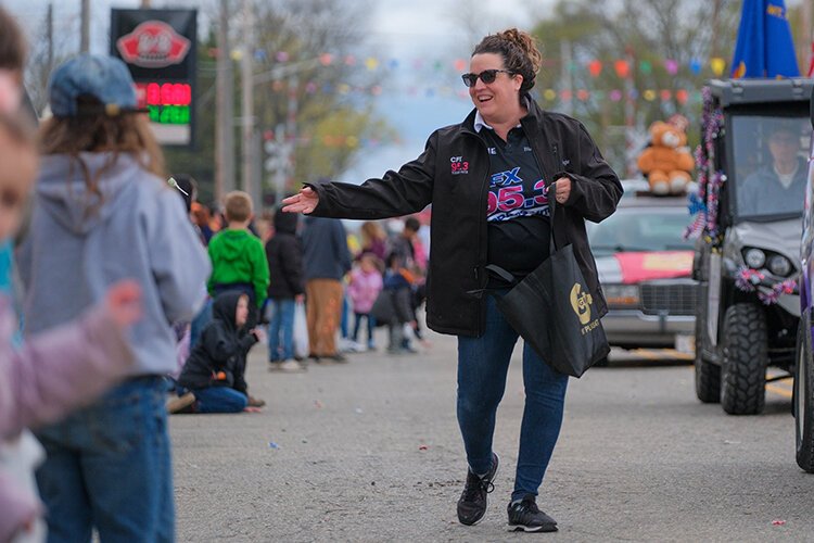 Black Diamond Broadcasting integrated marketing consultant and on-air host Angie Evans passes out candy at the Maple Syrup Festival Parade in Shepherd, MI on Sunday, April 30, 2023. (Photo: Dan Gaken/Epicenter)