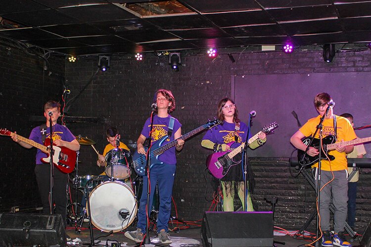 My Pet Rock band members Nathan Hohner (drums), Ethan Blom (bass), Liam Rountree (keys), Quentin Rossignol (red guitar), Charlotte Clifford (purple guitar), and Liam Murphy (black guitar) perform at Rubble's Bar in downtown Mt. Pleasant April 2023. (Photo courtesy of Donna Ronan)