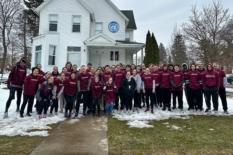 Sandy Hulme partakes in a celebration at Alma College for his 50-year running streak. (Photo courtesy of Alma College)