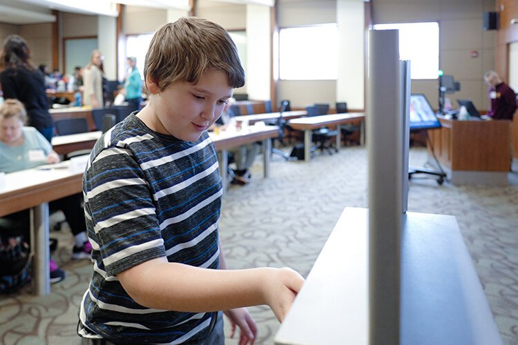 Attendees at the 8th annual United Way of Gratiot and Isabella County's PITCH-ER THIS! contest vote to determine which projects will received funding. (Photo: Dan Gaken/Epicenter)