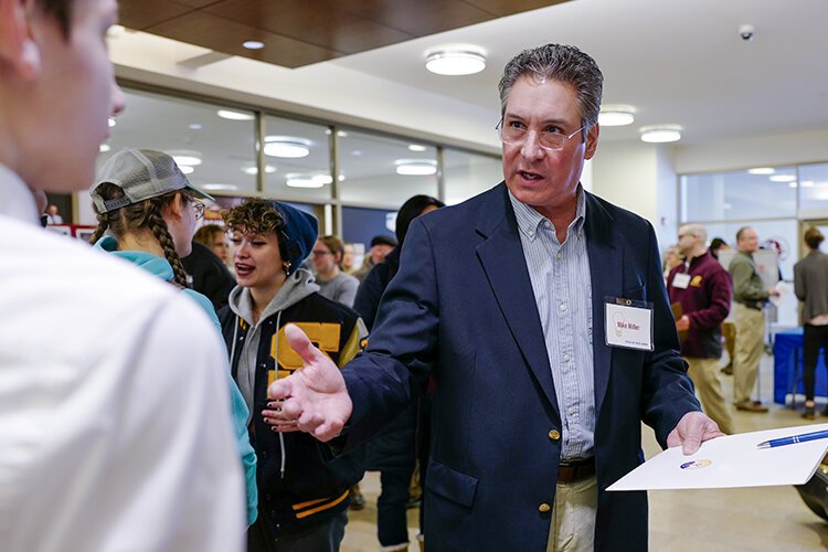 Commercial Bank Vice President Mike Miller speaks with students from Shepherd Middle School the United Way of Gratiot and Isabella County's PITCH-ER THIS! event. Shepherd students formed team Ready Shed Go! To ask for new sports equipment for their school. (Photo: Dan Gaken/Epicenter)
