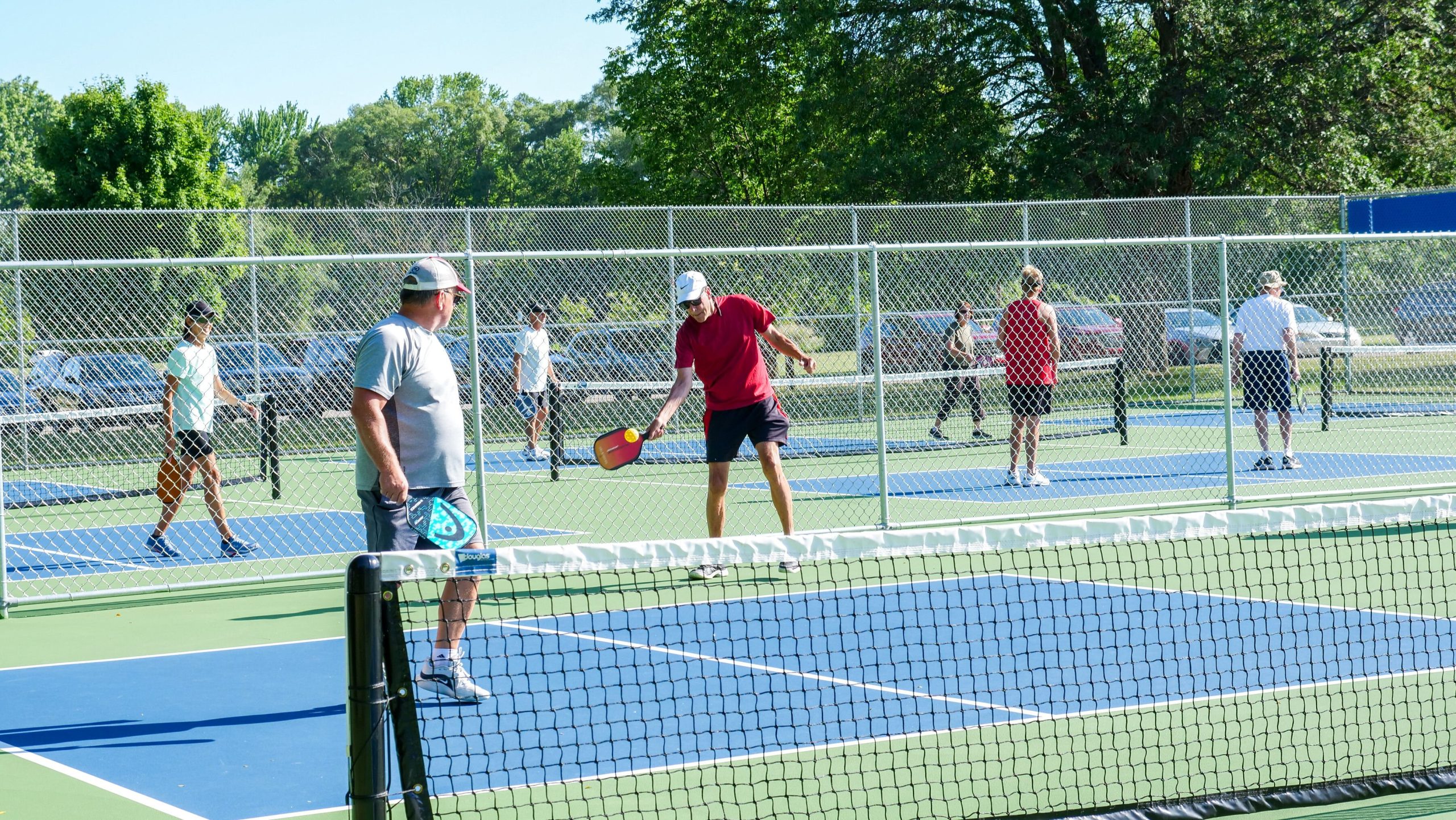 Al Montoye (red) is co-founder of the Mt. Pleasant Pickleball Club.