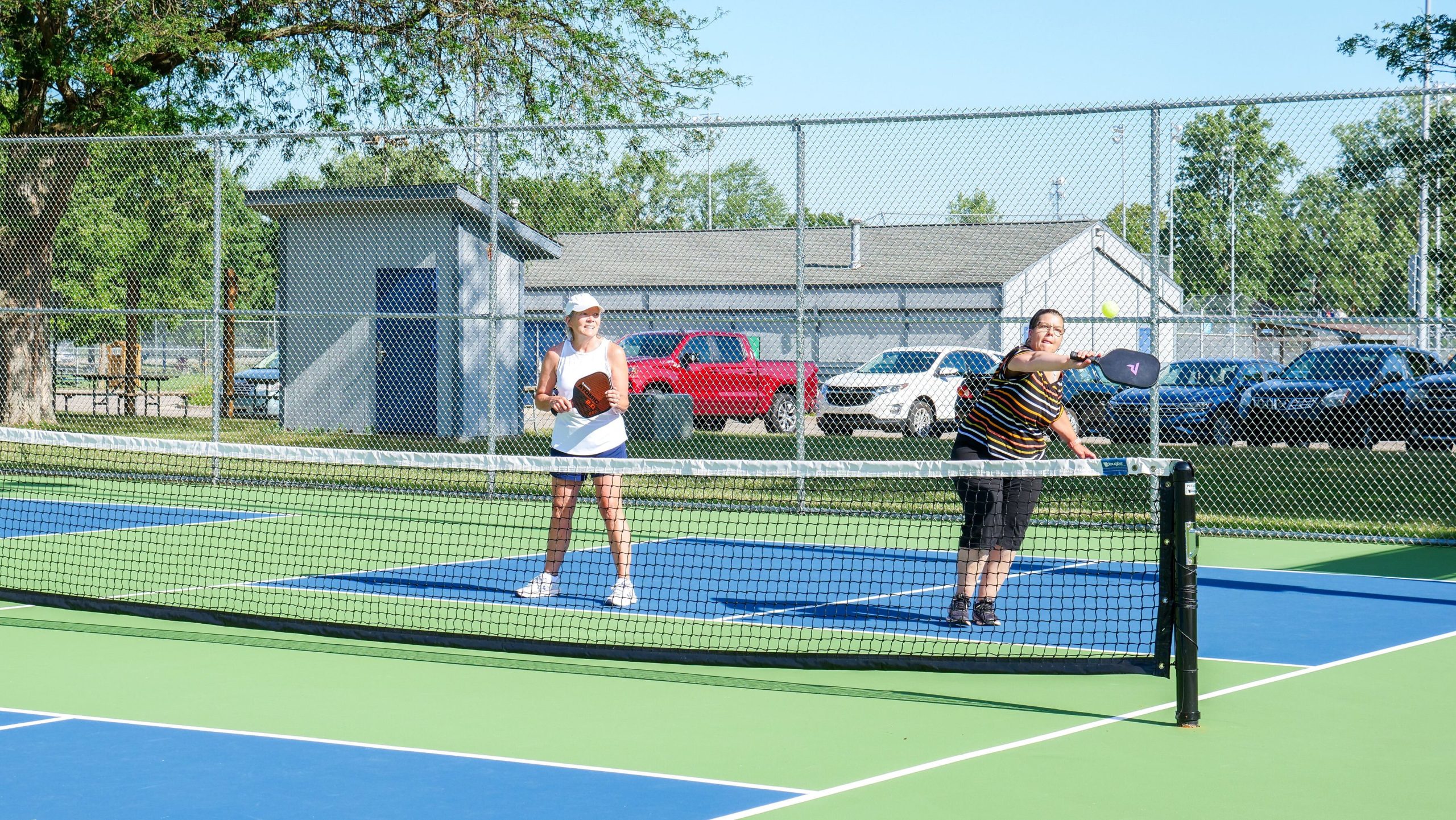 Wrisley (left) and Dunn (right) playing doubles at Island Park.