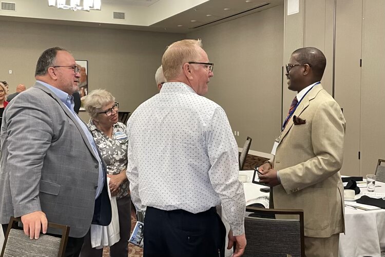 Quentin Messer visited with area businesspeople after giving the keynote.