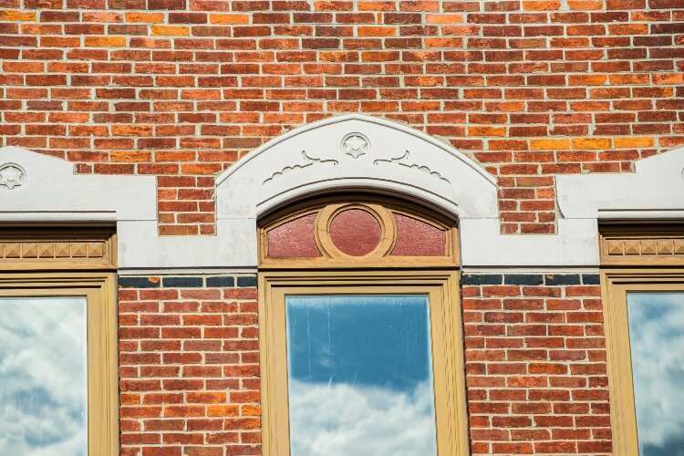 The Mosher building features facades on both Midland and Linn streets with jutting masonry on the front and side. 
