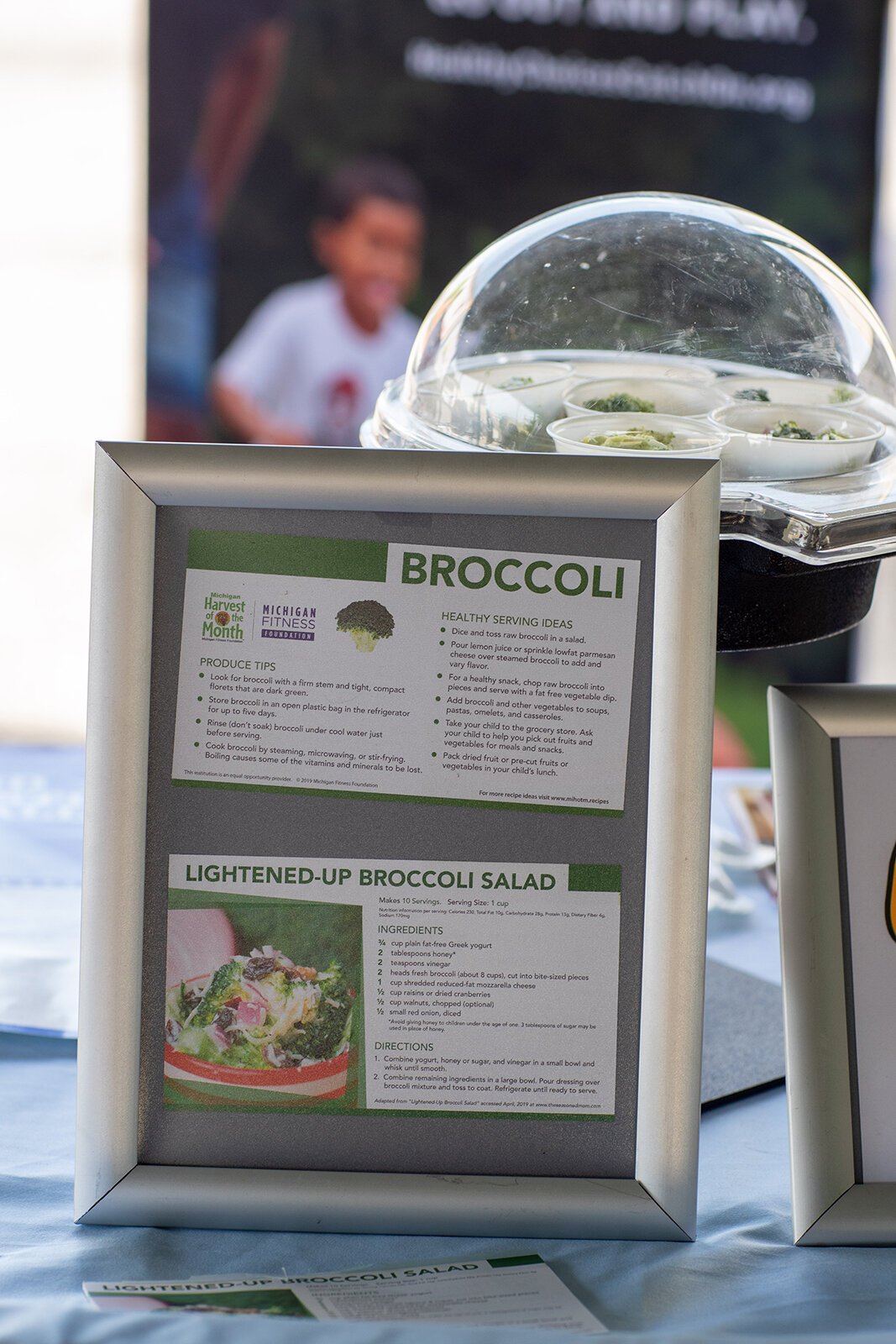 A broccoli tasting station set up by Farmers Market Food Navigators, including preparation tips and a recipe.