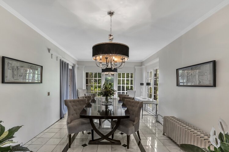 The Perry House includes more than 30 rooms with six fireplaces, a library, and an elevator.