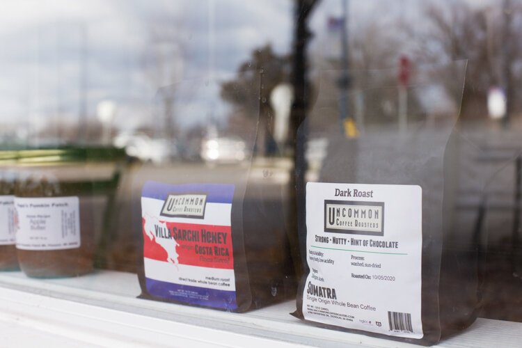 Merchandise is displayed in the new walk-up window at Pleasant City Coffee, located on Broadway Street in Mt. Pleasant.