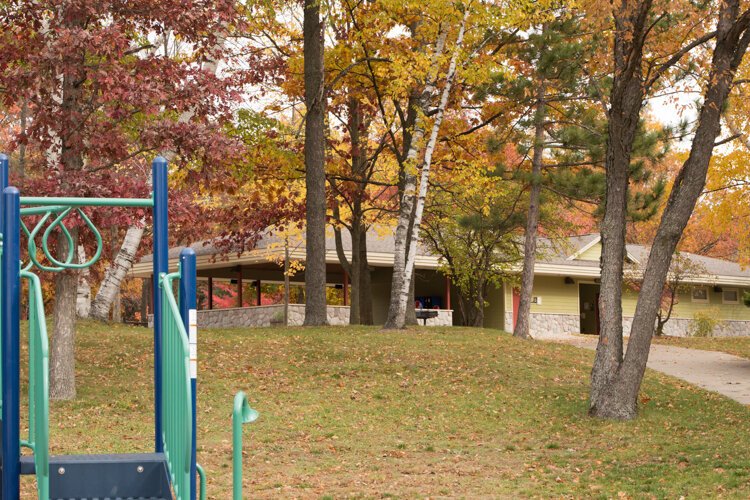 A playground area is located beside the pavilion and bathhouse at Coldwater Lake Family Park.