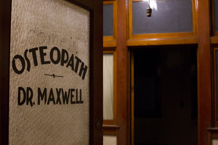The name of a tenant remains on an office door on the second floor of 200 E. Broadway in Mt. Pleasant, Michigan.

"There are these odd remnants as you walk around and to know that it had so many different businesses over the decades is pretty remarkable," says Michelle Sponseller, Downtown Development Director for the City of Mt. Pleasant. "The sheer scale of doors on the second and third floor are remarkable, and that would have been original growth lumber locally. It's the kind of thing that you would find a way to repurpose, I mean they're just too beautiful not to."