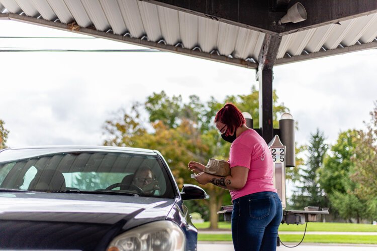Kira Trofatter, 18, of Mt. Pleasant, serves Jeremy Trofatter, 40, of Mt. Pleasant Sept. 13 at Jon’s Drive-In. “In November, I will have been here two years,” Kira says. “My aunt has worked here 12 years and I’ve always come here since I was a kid.”