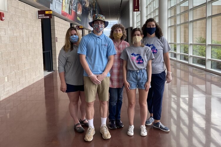 Kaitlin Otteman, 17, volunteering on May 28, 2020 at Central Michigan University when the Mount Pleasant Area Community Foundation was packaging masks for the community. Left to right is Emma Powell, Anderson Griffin-Strand, Nancy Wheeler, Kaitlin Otteman, and Sarah Case