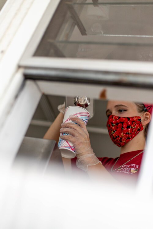 Olivia Rose Geisthardt, 17, of Mount Pleasant, prepares an order Aug. 30 at Doozie’s Ice Cream Place. Geisthardt has been working at Doozie’s for about three months and first remembers going to the ice cream shop at age four. 