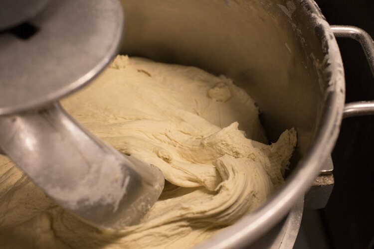 Vin Trofeo's pizza dough is make from scratch in-house, without any sugar.

"Sugar is a major source for most dough that's made out there because yeast feeds on sugar which helps the proofing process," says Baird. "But sugar also adds a different flavor to dough and that can be a deterrent for some people that have to avoid sugar."